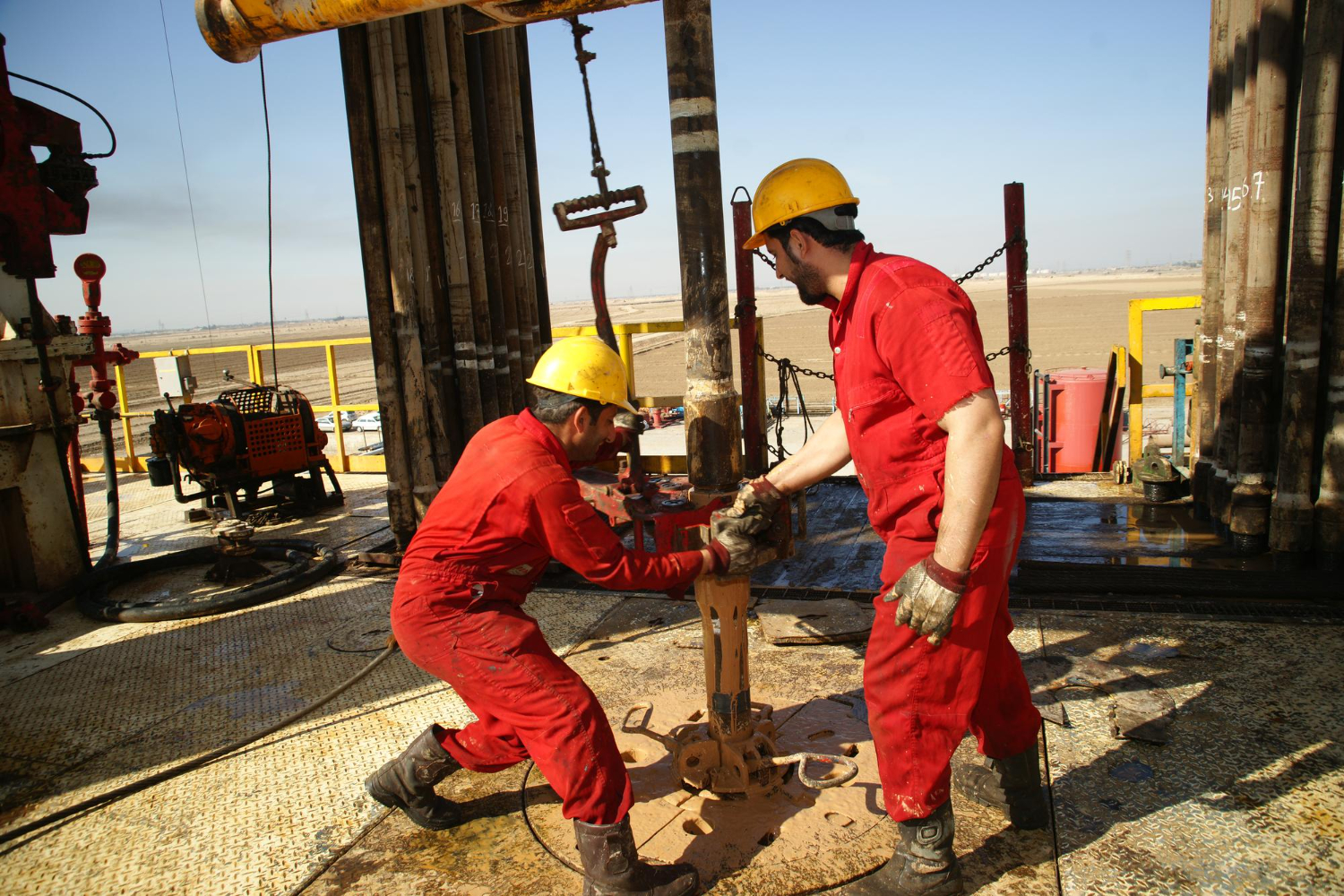 Field team working on oilfield equipment